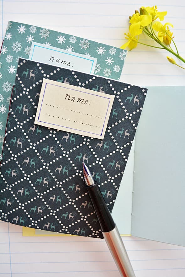Open notebook with handwritten lists on a desk