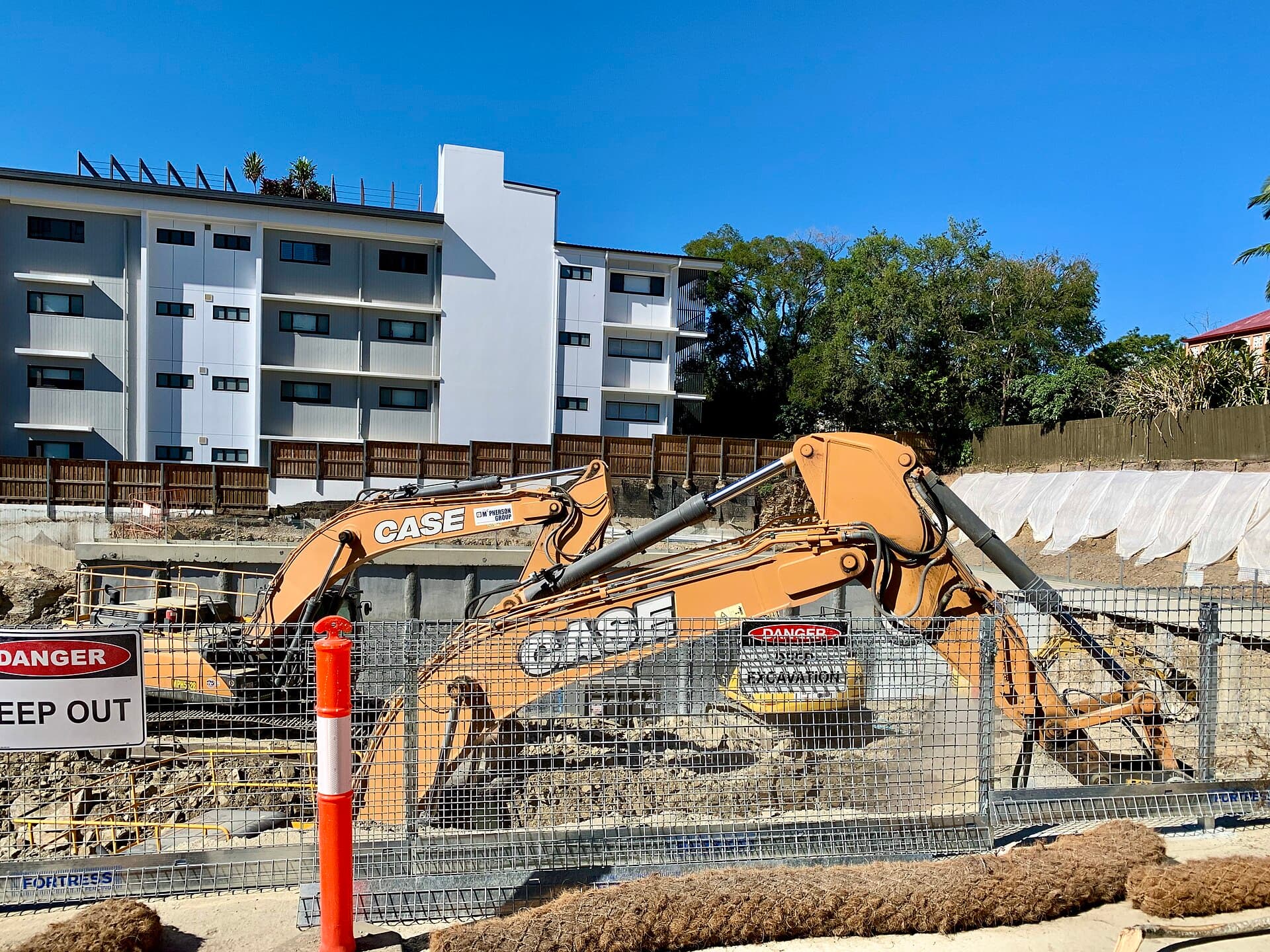 Building construction site with scaffolding and cranes in Indooroopilly, Queensland